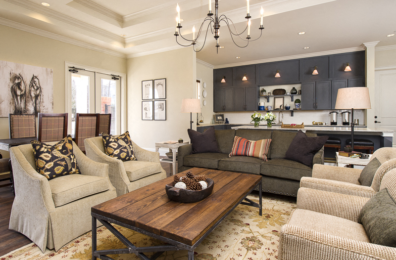 a living room with couches and chairs and a coffee table